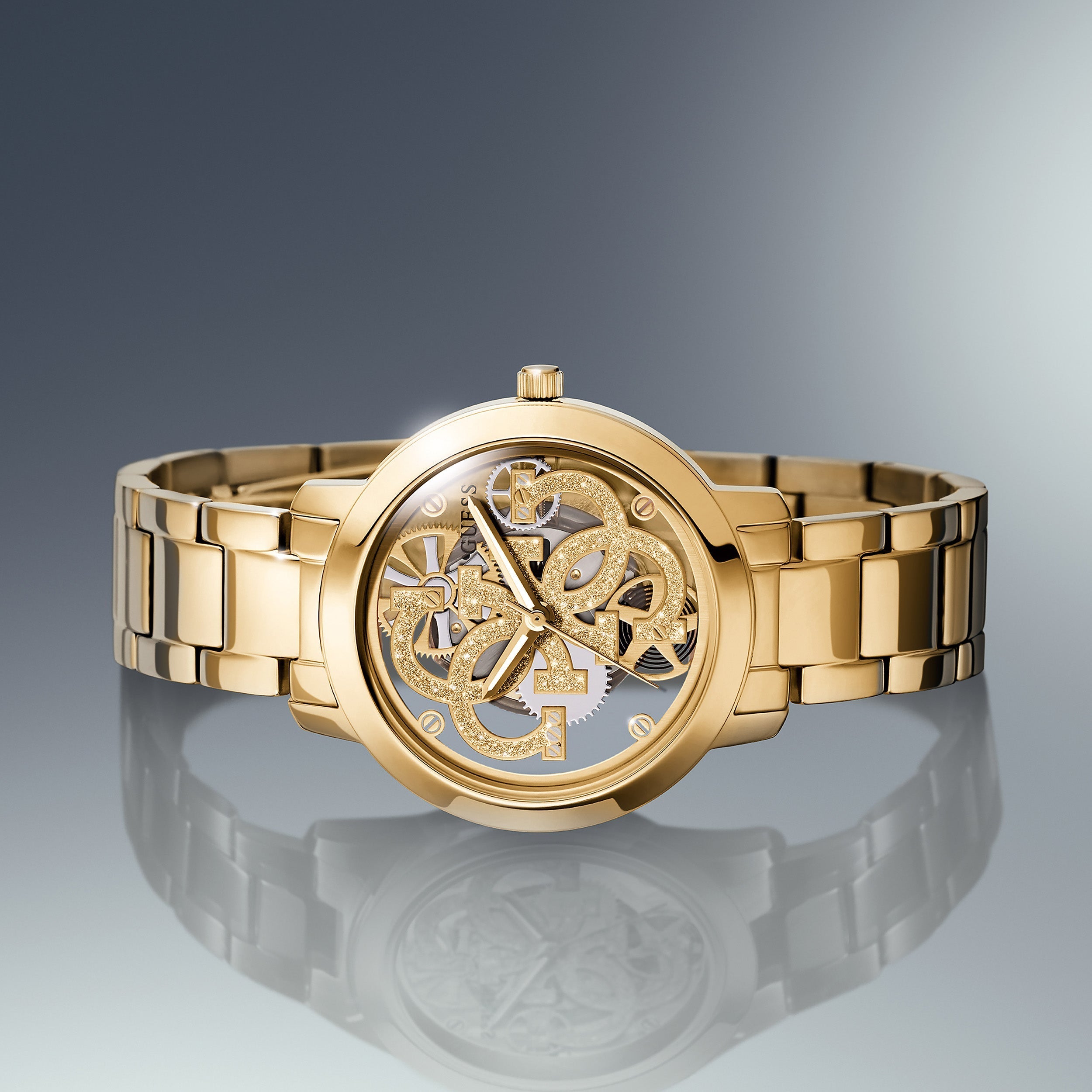 Guess Ladies Quattro Clear Gold Watch